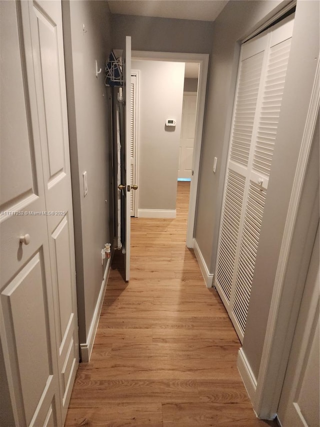 hall with light hardwood / wood-style floors