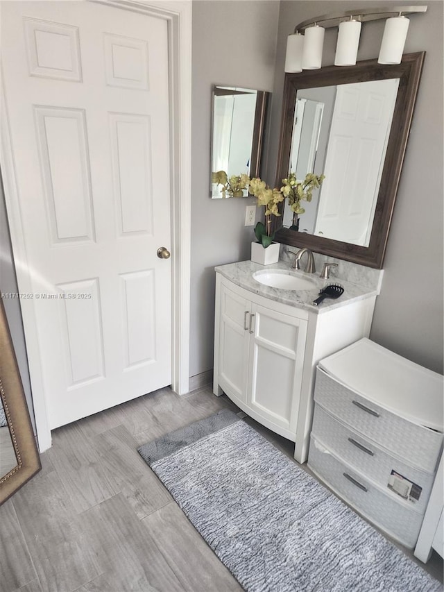 bathroom featuring wood-type flooring and vanity