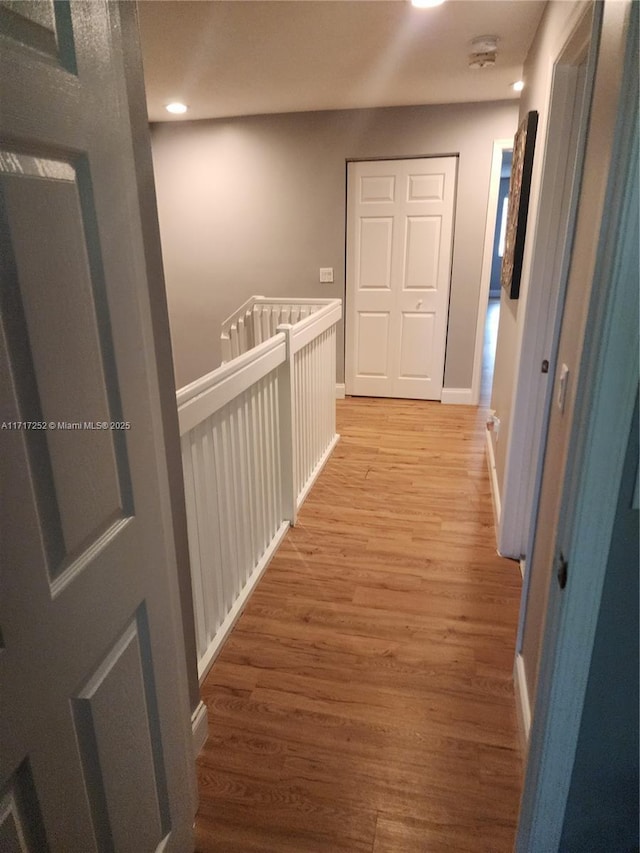 hall featuring wood-type flooring