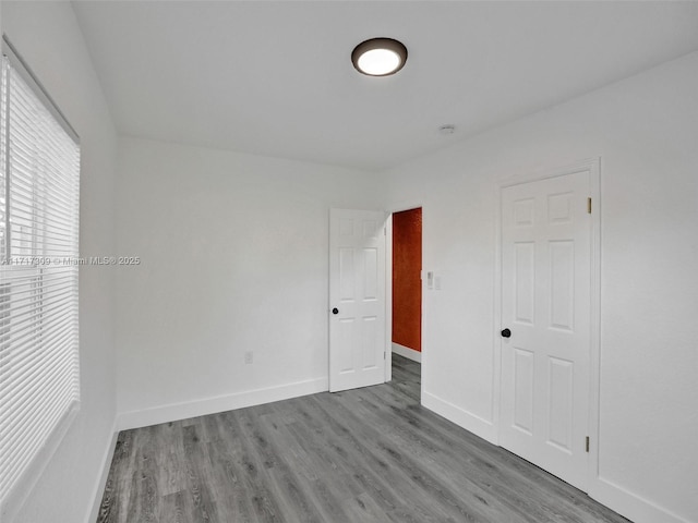 empty room featuring wood-type flooring