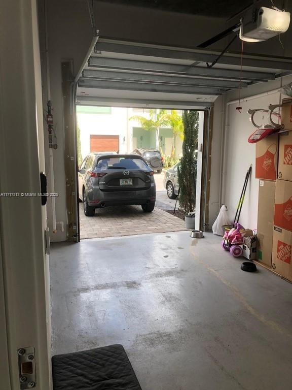 garage featuring a garage door opener