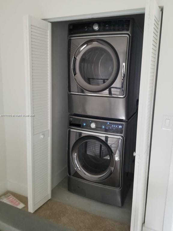 laundry room featuring laundry area and stacked washing maching and dryer