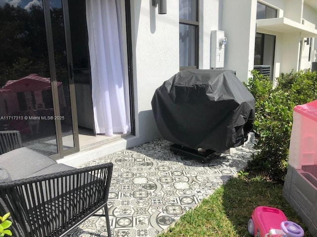 view of patio featuring a grill