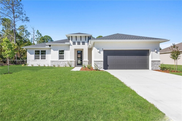 prairie-style home featuring a front lawn and a garage