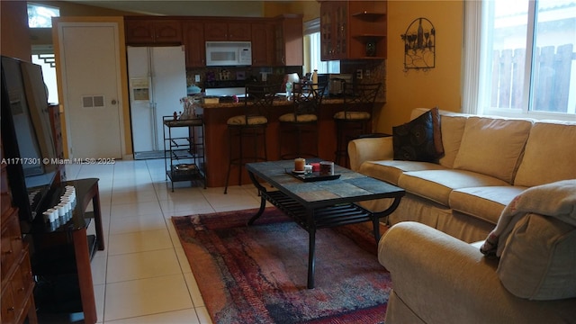 living room featuring light tile patterned floors