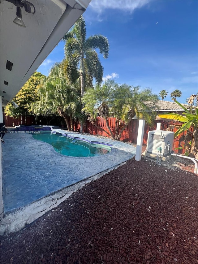 view of pool featuring a fenced in pool, a patio area, and a fenced backyard