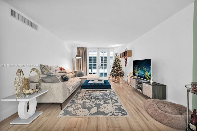 living room with light hardwood / wood-style floors