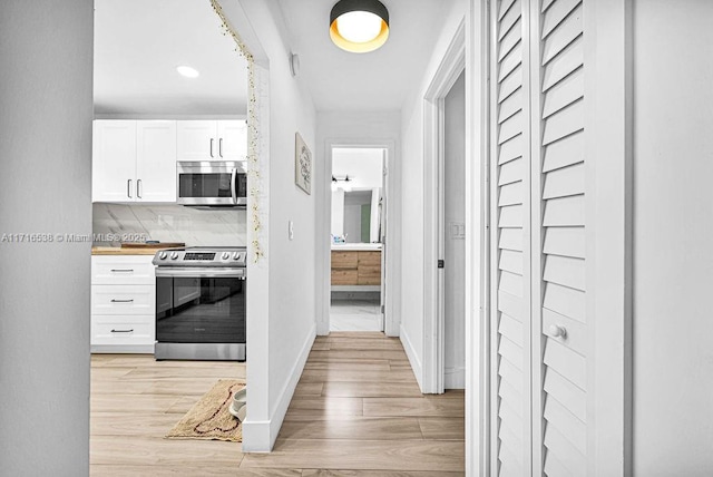 hall featuring light hardwood / wood-style floors