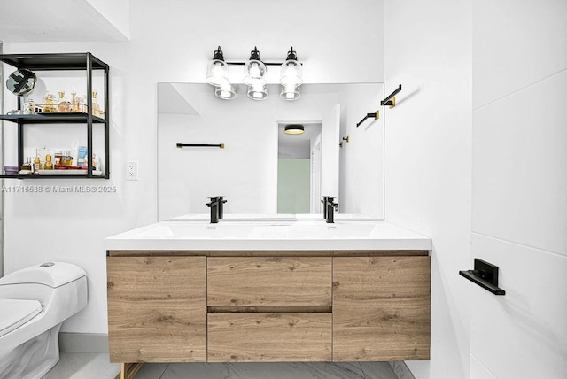 bathroom with vanity and toilet