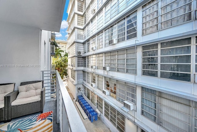 balcony featuring a wall unit AC