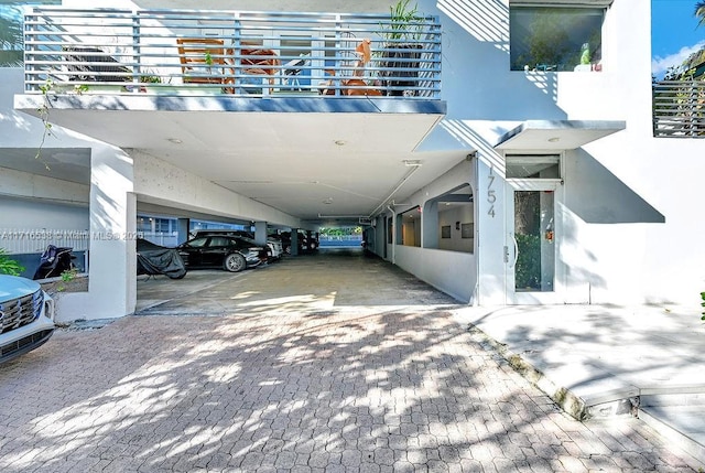 exterior space with a carport