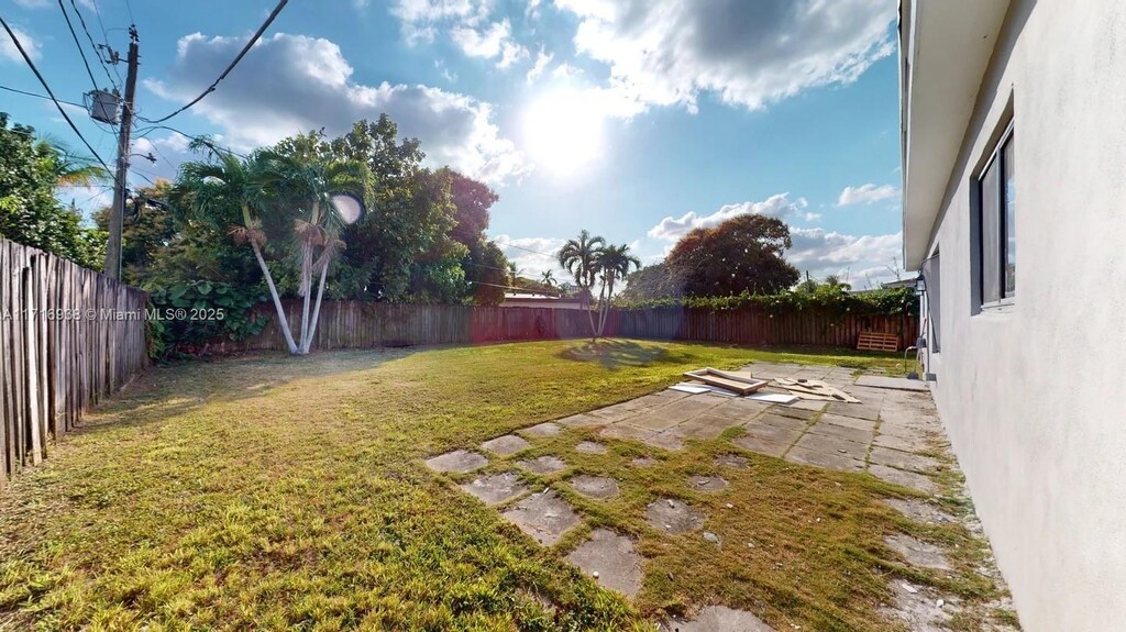 view of yard featuring a patio area and a fenced backyard