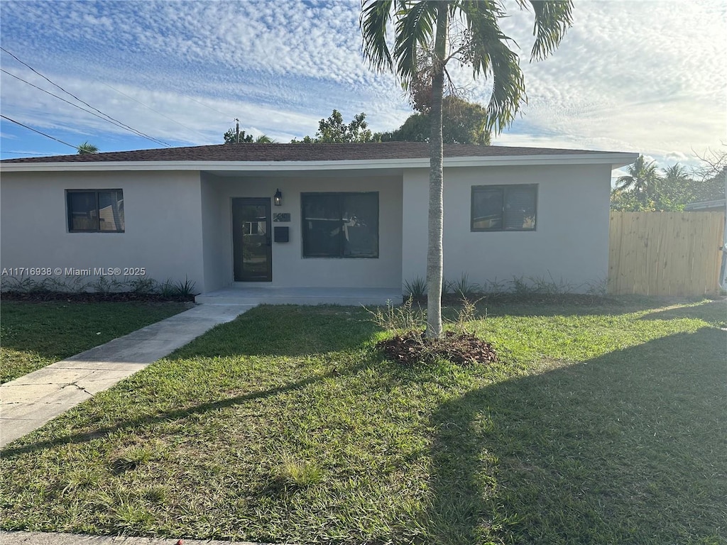 830 NE 171st St, North Miami Beach, FL 33162 - ranch-style home featuring stucco siding and a shingled roof