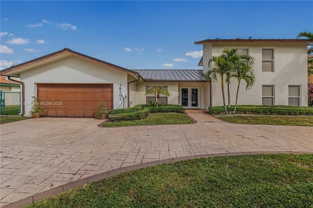 view of front of home featuring french doors and a garage