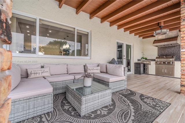 view of patio featuring an outdoor living space, a deck, grilling area, and french doors