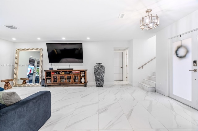 living room featuring an inviting chandelier