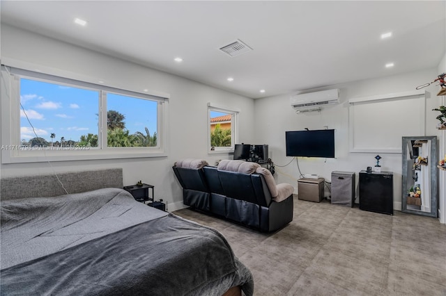 bedroom featuring a wall mounted AC