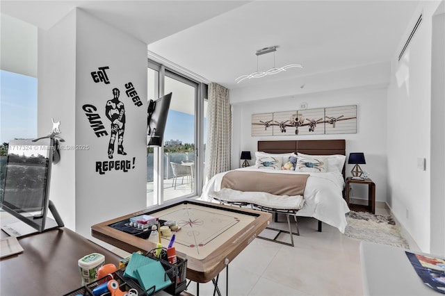 bedroom featuring light tile patterned floors and access to outside