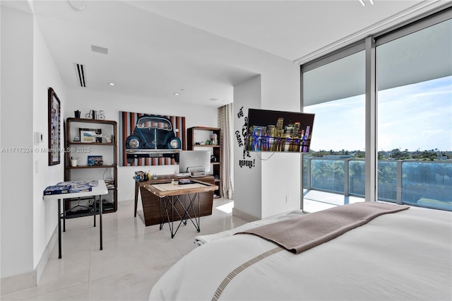 bedroom featuring floor to ceiling windows and access to exterior