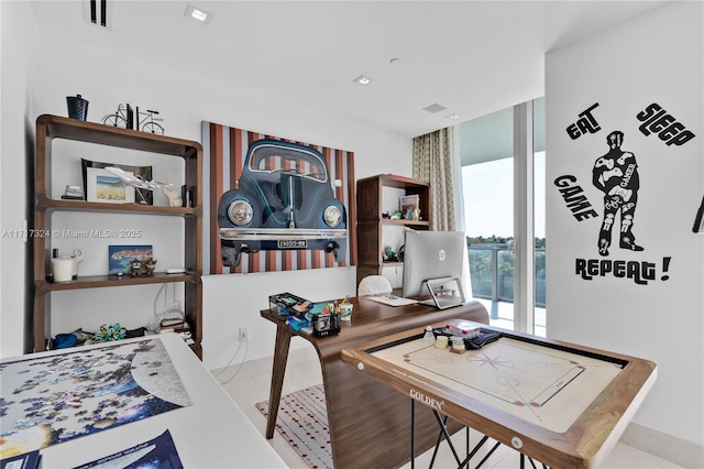 home office featuring floor to ceiling windows