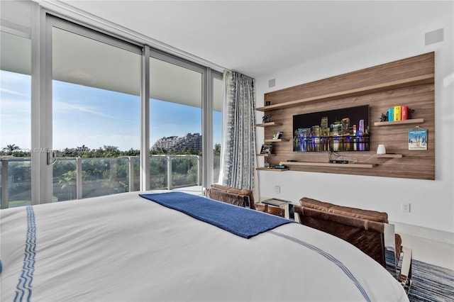 bedroom featuring floor to ceiling windows