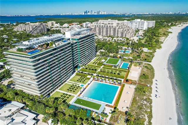 drone / aerial view with a water view and a view of the beach