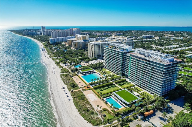 drone / aerial view featuring a water view and a view of the beach