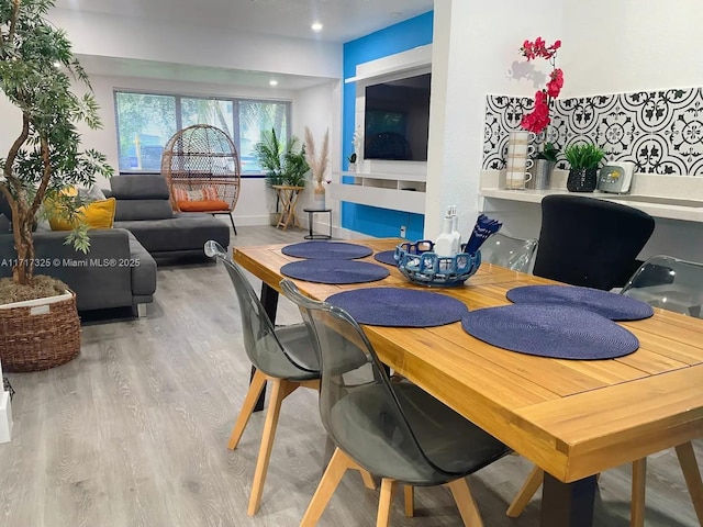 dining room with light hardwood / wood-style flooring