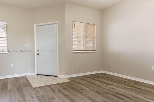 empty room with light hardwood / wood-style floors