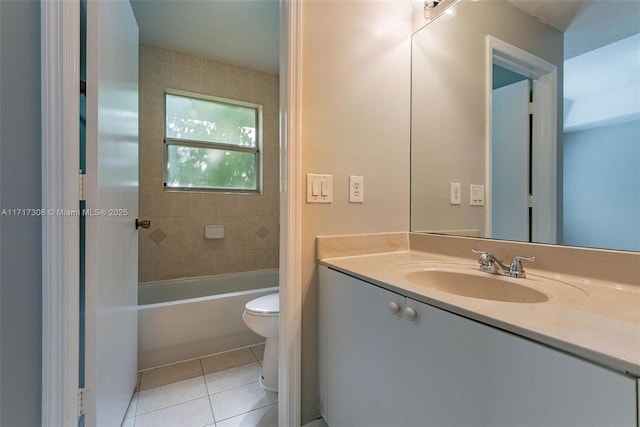 bathroom featuring tile patterned floors, vanity, and toilet