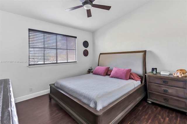 bedroom with ceiling fan and dark wood-type flooring