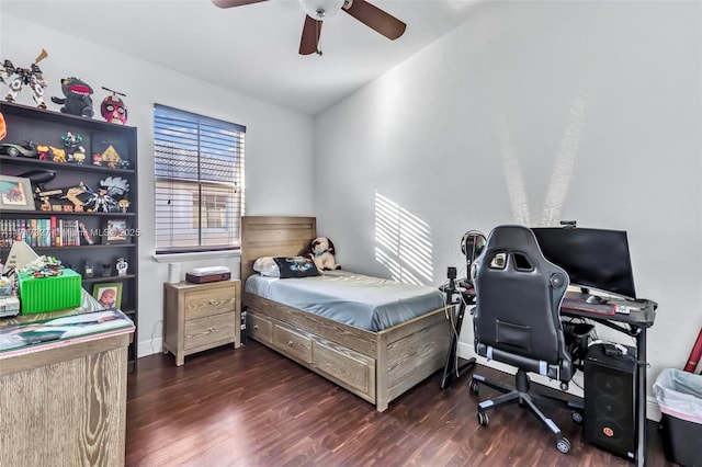 bedroom with ceiling fan and dark wood-type flooring