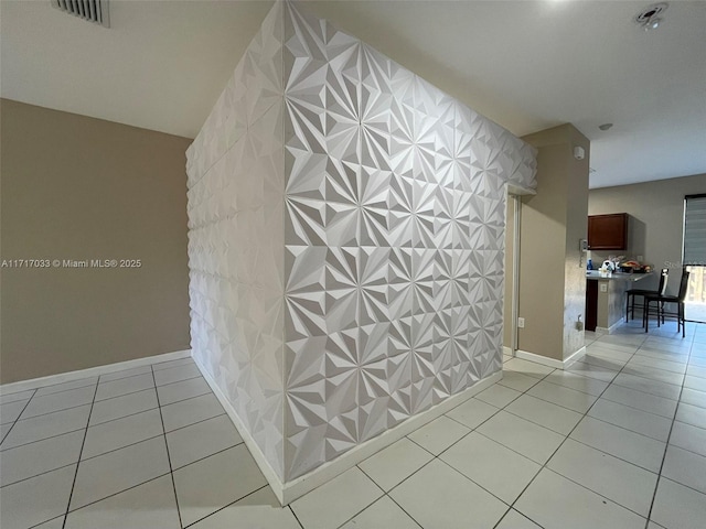 corridor with light tile patterned flooring