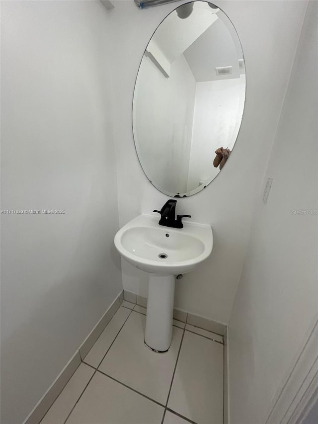 bathroom with tile patterned flooring and sink