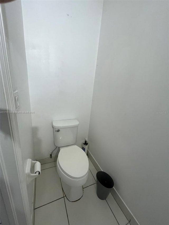 bathroom featuring tile patterned floors and toilet