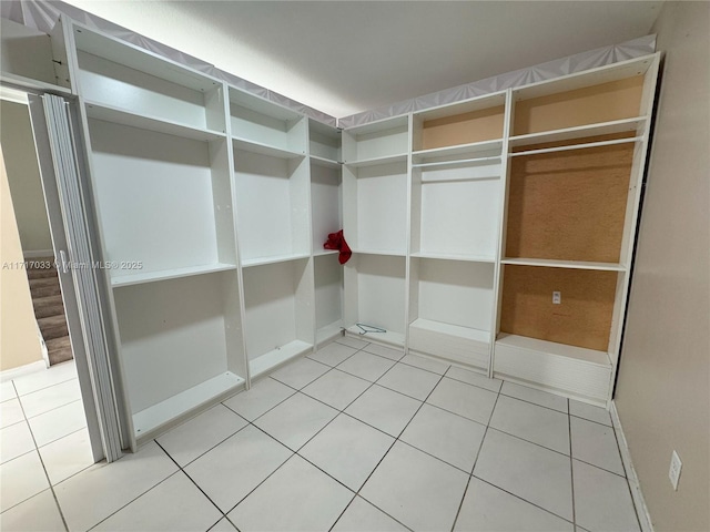 walk in closet featuring light tile patterned floors