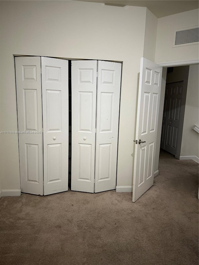 unfurnished bedroom featuring carpet