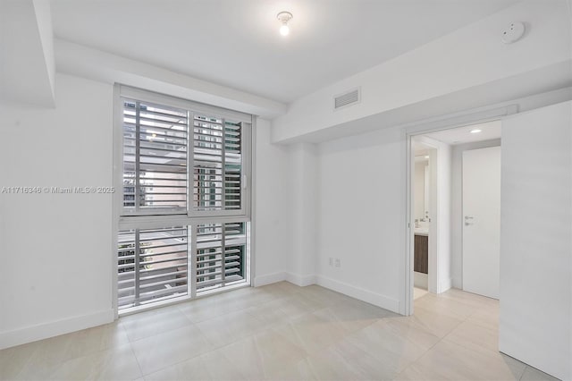 view of tiled spare room