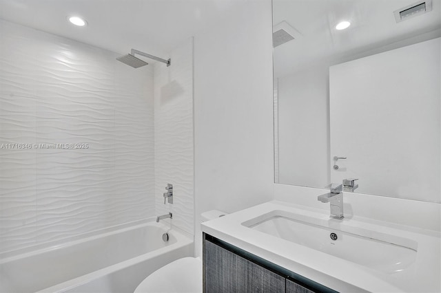 full bathroom with vanity, washtub / shower combination, and toilet