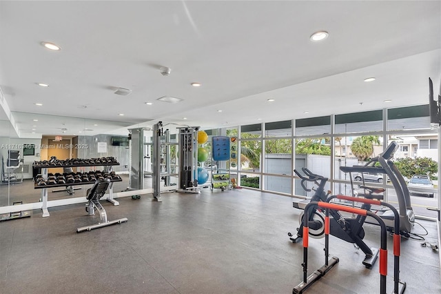 exercise room with floor to ceiling windows