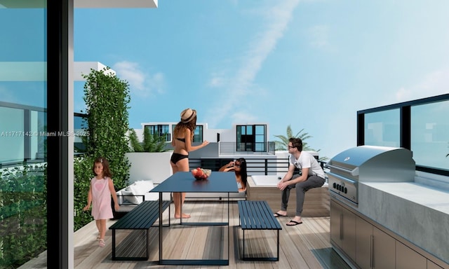 balcony with an outdoor kitchen and area for grilling