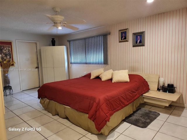 tiled bedroom with ceiling fan