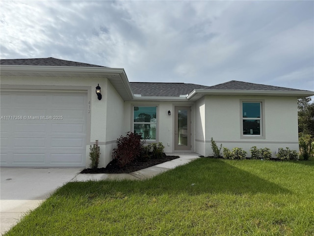 ranch-style home with a front lawn and a garage