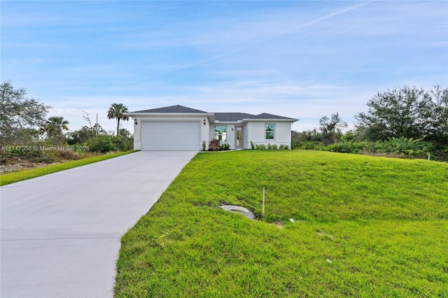 view of front facade featuring a garage and a front yard