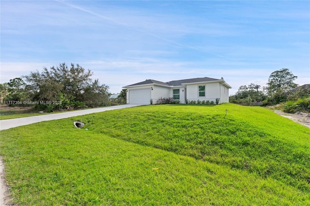 ranch-style home with a garage and a front yard