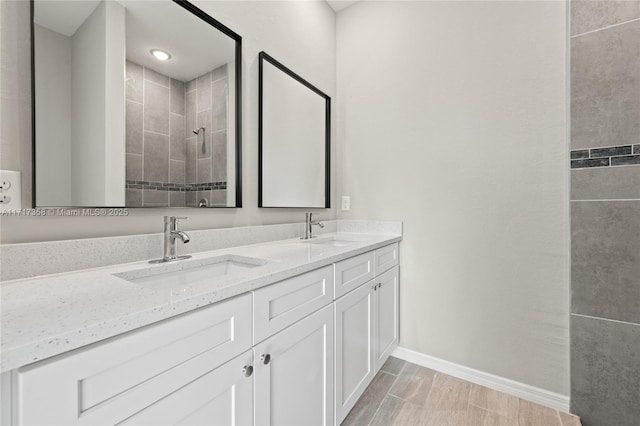 bathroom featuring vanity and a tile shower