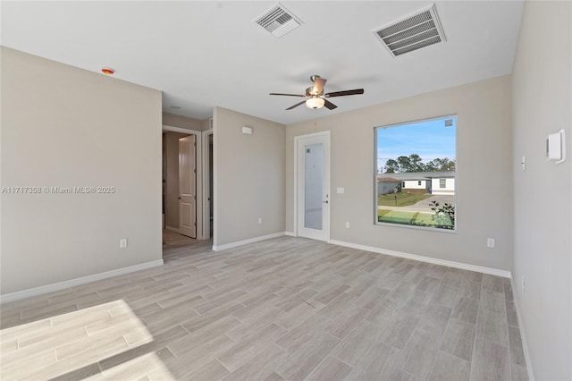 spare room featuring ceiling fan and light wood-type flooring