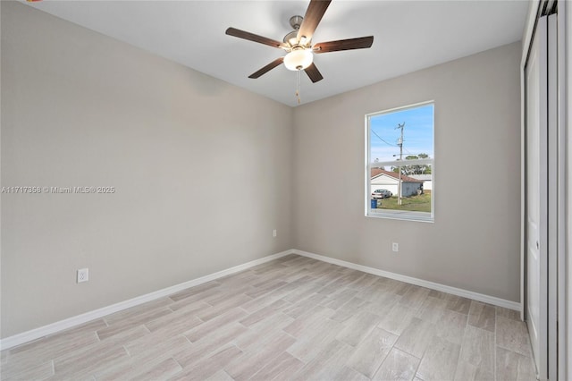 empty room featuring ceiling fan and light hardwood / wood-style flooring