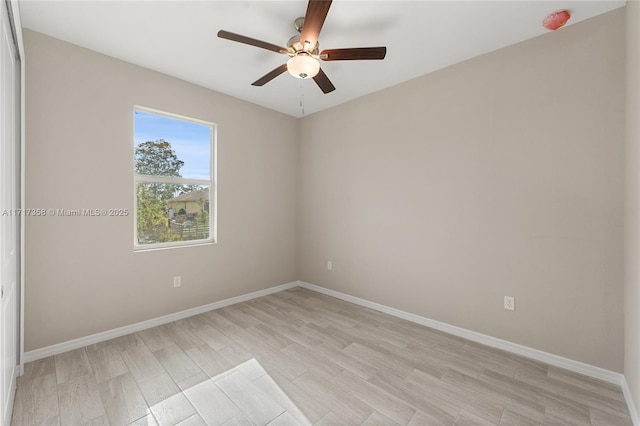 unfurnished room featuring light hardwood / wood-style floors and ceiling fan