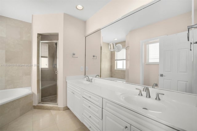 bathroom featuring tile patterned flooring, vanity, and independent shower and bath